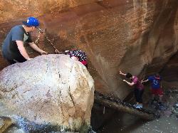 Climbing the ladder to get to the upper falls by Tyler Burgener